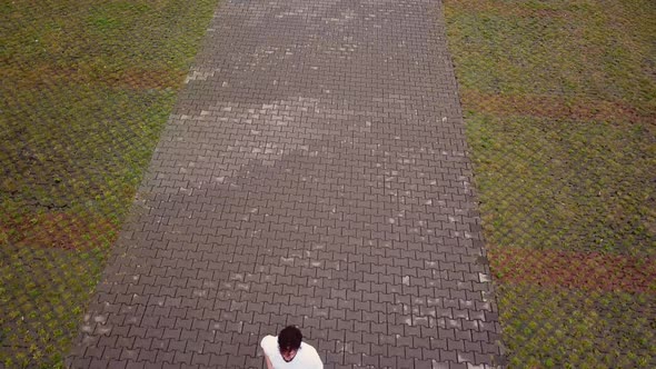 a Man Running a View From a Height alt