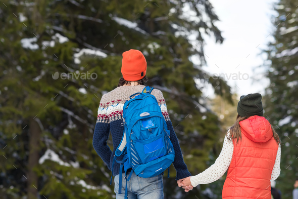 Romantic Couple Snow Forest Outdoor Winter Walk Man And Woman Holding Hands Back Rear View