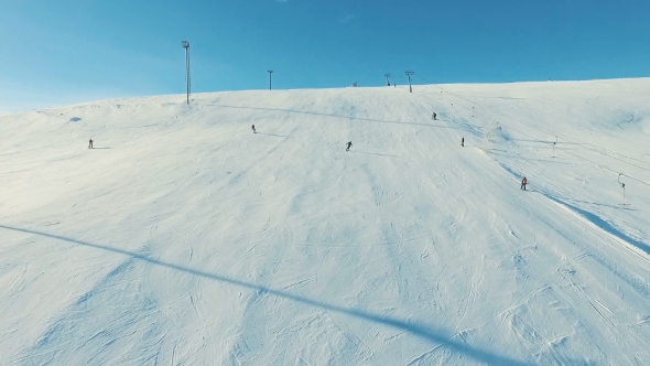 Several People Ride Ski and Snowboard By Snow Slope