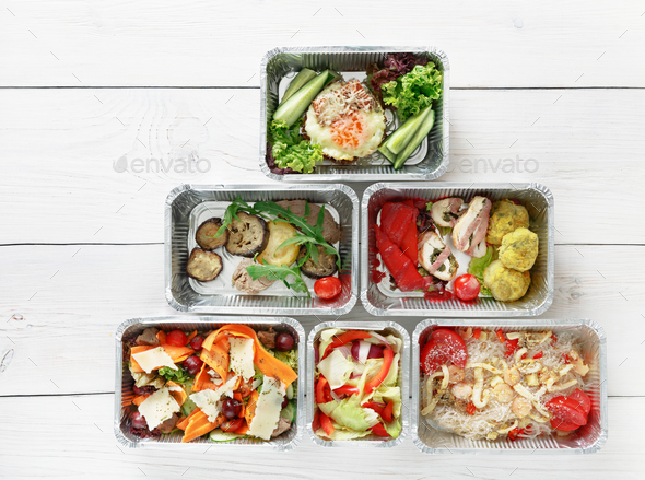 Healthy food take away in boxes, top view at wood - Stock Photo - Images