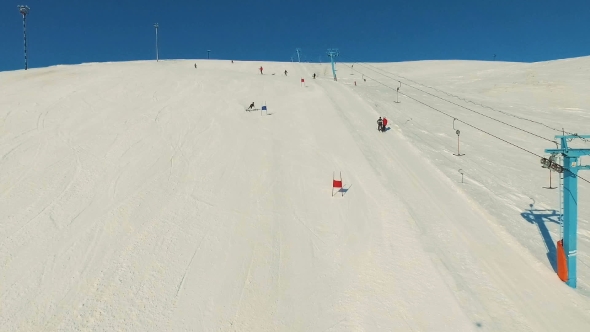 Skier Rides Downhill on Track