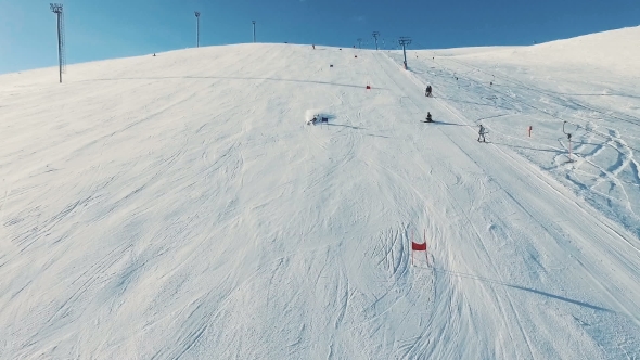 Skier Rides Dounhill on Track