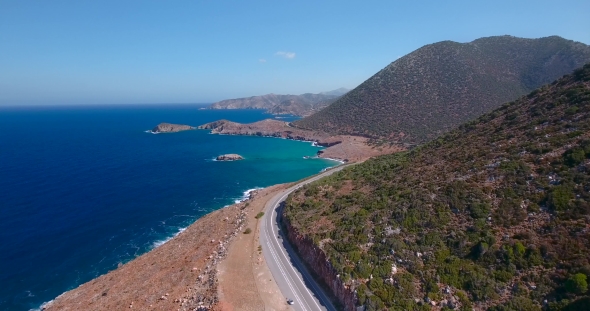 Flying Above Road By Seashore