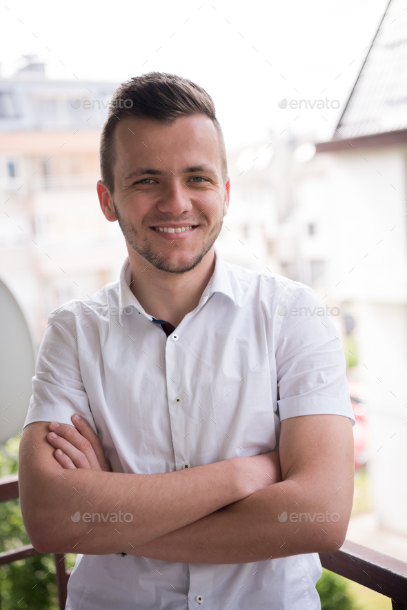 man standing at balcony - Stock Photo - Images