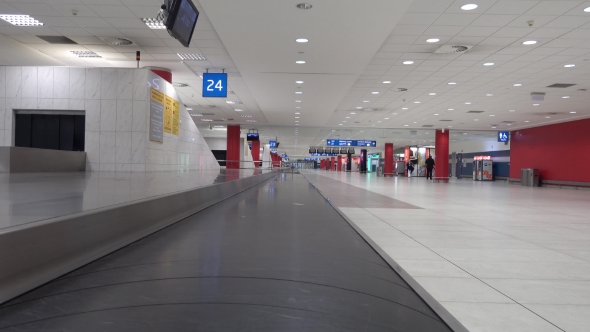 Lost Suitcase Moving on the Conveyor in the Airport