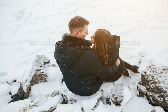 beautiful young couple posing in a snowy park, close view, Stock Photo,  Picture And Rights Managed Image. Pic. ZON-9586920 | agefotostock