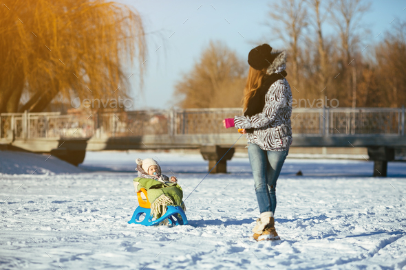 mother and daughter in winter outdoors - Stock Photo - Images