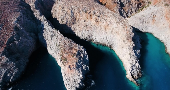 Blue Sea, Waves Breaking in Cliffs at Shore