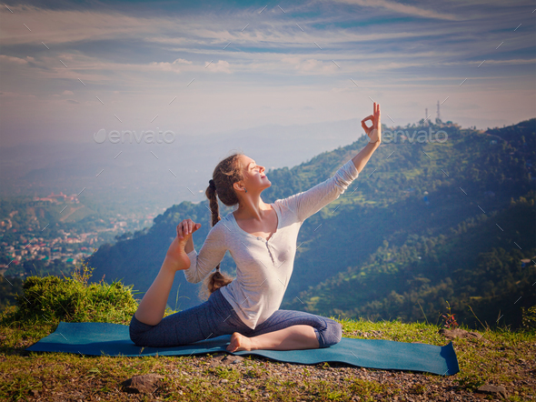 Sorty fit woman doing yoga asana outdoors in mountains - Stock Photo - Images