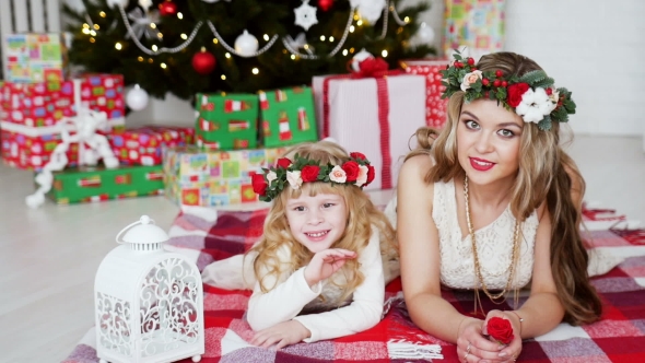 Family Around Christmas Tree. New Year's Holidays
