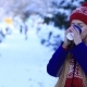 Smiling Young Woman Drinking Coffee in Cold Winter - VideoHive Item for Sale
