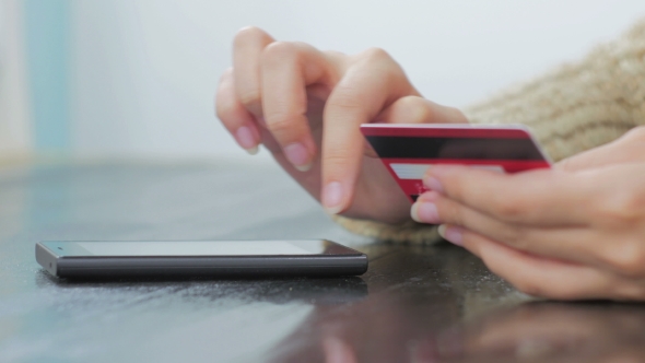 Woman Shopping Online at Smartphone with Credit Card