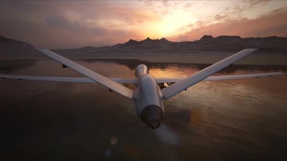 Military predator drone flying at sunset. Intelligent unmanned vehicle.
