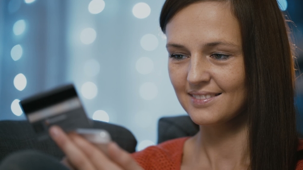 Woman Shopping Online Using a Credit Card Smartphone and Mobile App alt