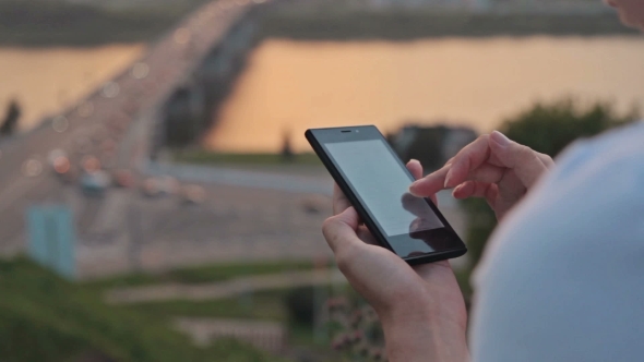 Woman Using Mobile on the Street