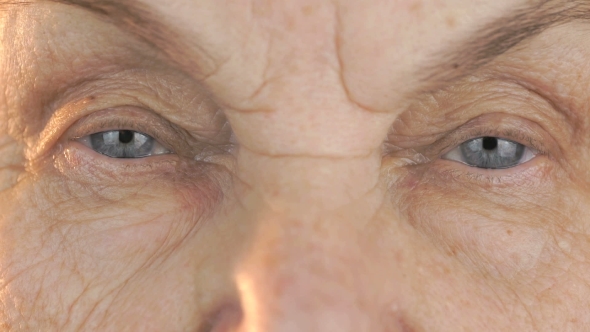 Elderly Woman's Face with Tired Expression of Face