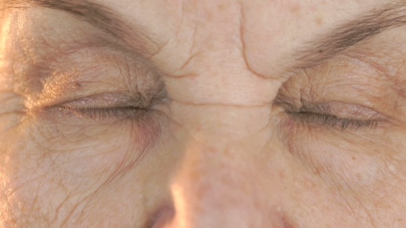 Old Woman's Face with Disturbing Look of Face alt