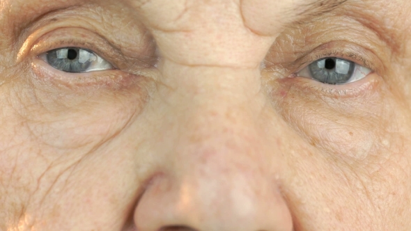 Elderly Woman's Face with Tired Expression of Face