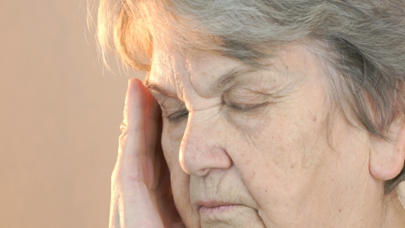 Old Woman Suffers From Headaches. Face