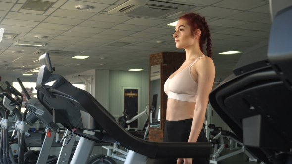 Woman Walking on Treadmill