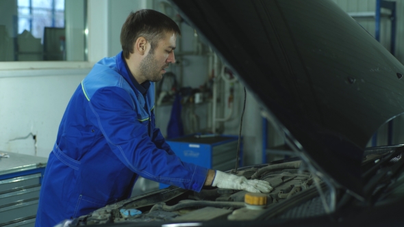 Mechanic at Work in His Garage, Stock Footage | VideoHive