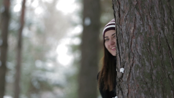 Girl in the Forest Plays with Snow