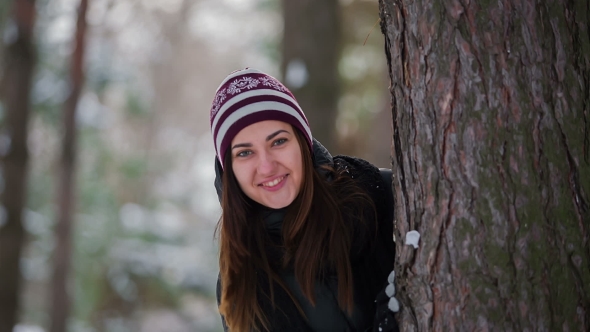 Girl in Winter Forest Posing on Camera