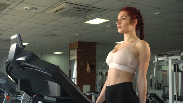 Woman Walking on Treadmill