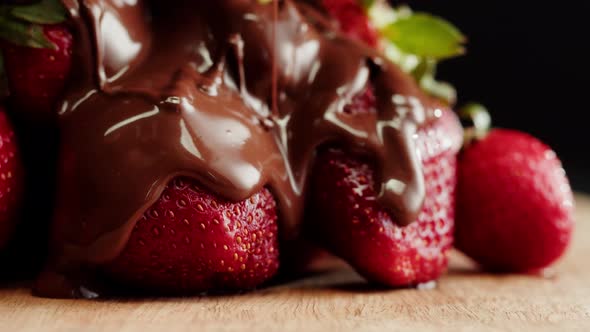 Strawberry in Melted Chocolate Closeup Melting Chocolate Bar for Fondue alt