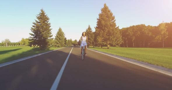 Beautiful Girl Rides on the Vintage Bike alt