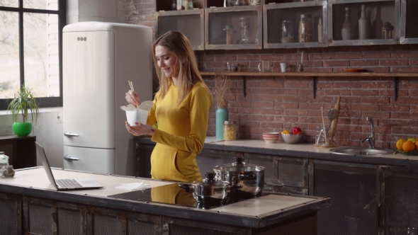 Lady Enjoy Asian Cuisine in Flat. alt