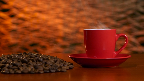Cup on a Red Saucer of Hot Coffee on the Aroma Spreads Room alt