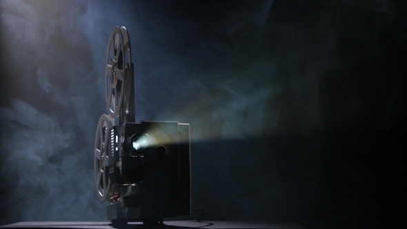 Illuminated Projector in a Dark Room Shows Movie, Stock Footage | VideoHive