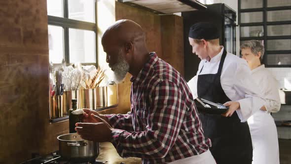 Chef smelling a cream alt