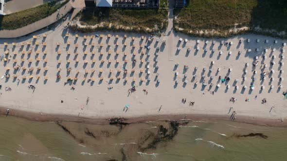 Tourist Beach in Baltic Sea Seen From Aerial Birds Eye Overhead Top Down Drone View Beach with alt