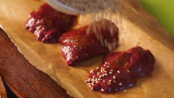 Chicken Liver Is Spread on a Beautiful Plate and Collapses in Sesame Seeds.