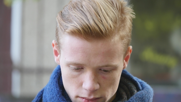 Handsome Young Man Looking at Camera Outdoor