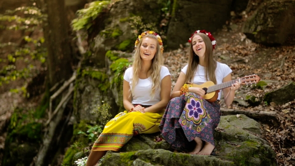 Two Young Girls with Guitar in a Summer Forest alt