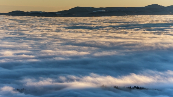 Dense Fog Rolling Through Carpathian Mountains. Winter Landscape alt