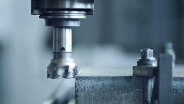 CNC Milling Machine Produces Metal Detail on Factory