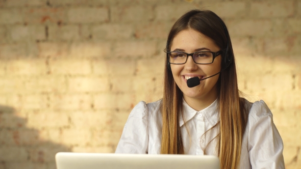 Beautiful Smiling Brunette Working in Call Center alt