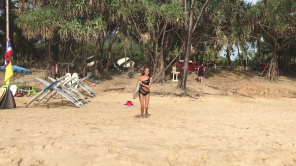 Sexy Woman In Bikini With Her Surfboard