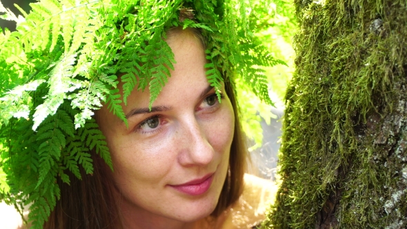 Portrait of a Girl with a Wreath on His Head. Beautiful White Girl with Freckles, a Wreath of Fern