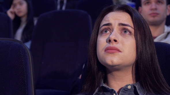 Woman Watches Drama at the Movie Theater alt
