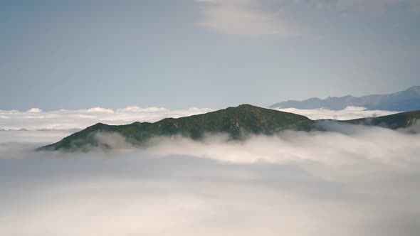 8K Sea of Clouds Landscape From Mountain Summit at Above the Clouds