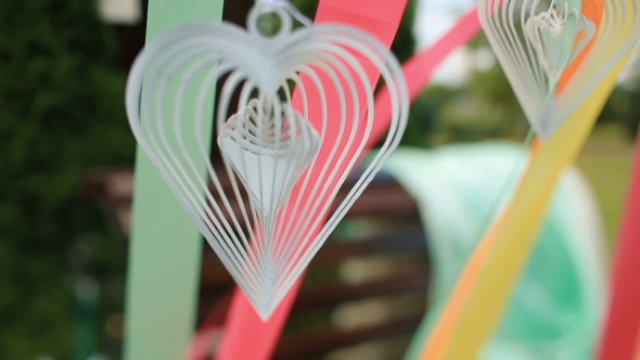 White Paper Heart Whirls Among Ribbons