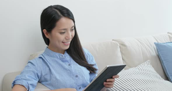 Woman watch on tablet computer alt