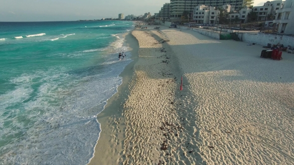 Aerial Footage of Cancun Beach. Drone Flying Above Shore Line with Hotels