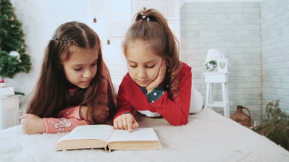 Two Children Sitting in a White Room, Reading a Book in the Background Green Tree.