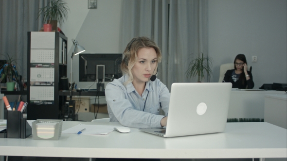 Customer Support Operator Working in a Call Center Office alt